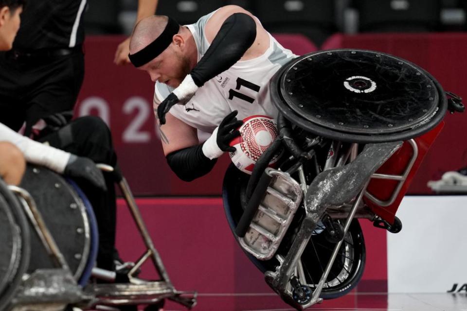 Mark Ingemann Peters of Denmark falls during a pool phase group match of wheelchair rugby.