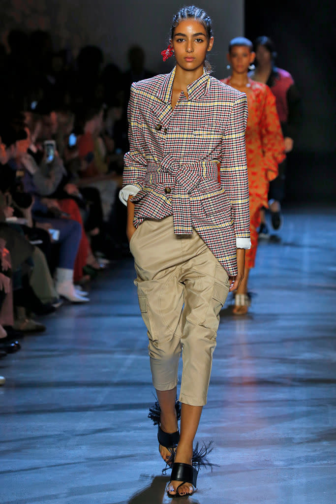 <p>From cargo pants to cargo skirts and cargo jackets, the trend was everywhere on the catwalk. This classic utilitarian style receives a fresh update this season. Here, a model walks the Prabal Gurung Spring 2019 show wearing cropped khaki cargo trousers and a plaid blazer. (Photo: Getty Images) </p>