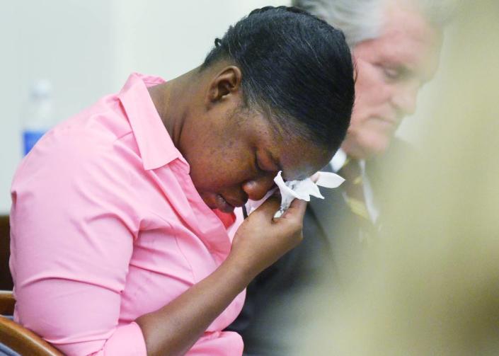 Shayla Bryan, accused of the attempted murder of her daughter in December 2011, begins to weep as a videotape of her interrogation by the Beaufort Police Department is played during her trial May 20, 2014, at the Beaufort County Courthouse. Next to her is defense attorney Russell Keep. Jay Karr