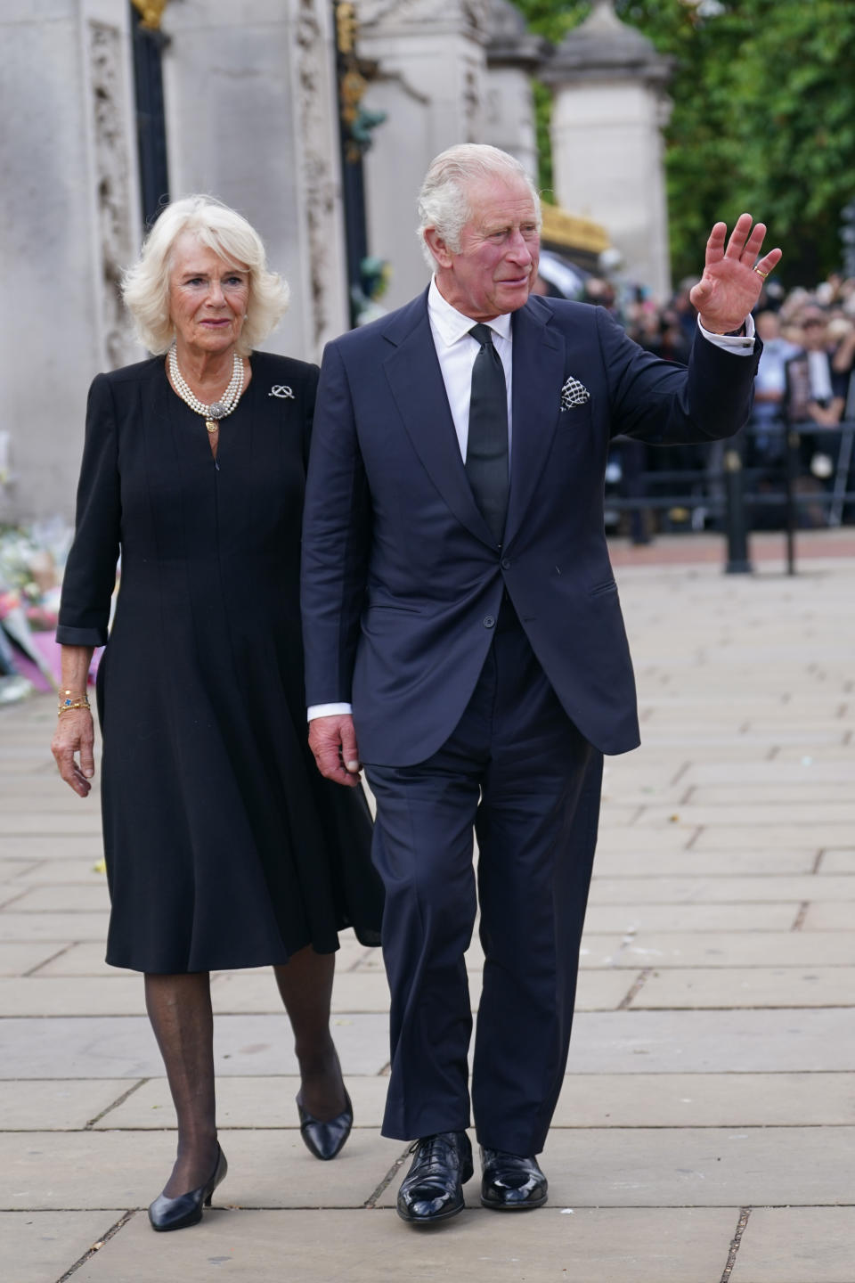 The Queen Consort and King Charles III arriving at Buckingham Palace on Friday. (PA)