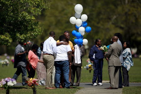 Relatives and friends gathered to remember Walter Scott, at Live Oak Memorial Gardens in Charleston, South Carolina, April 4, 2016. REUTERS/Randal Hill