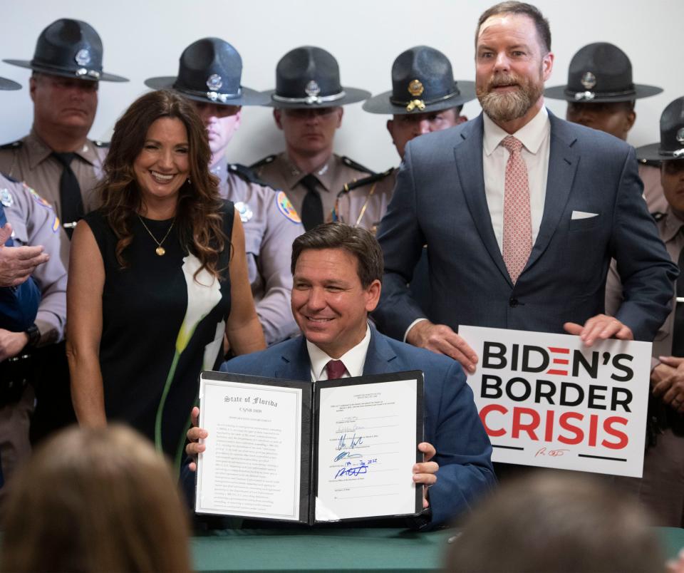 Gov. Ron Desantis signed Senate Bill 1808 into law during a ceremony at the Escambia County Sheriff's Office on Friday, June 17, 2022, as state lawmakers and law enforcement officials look on. 