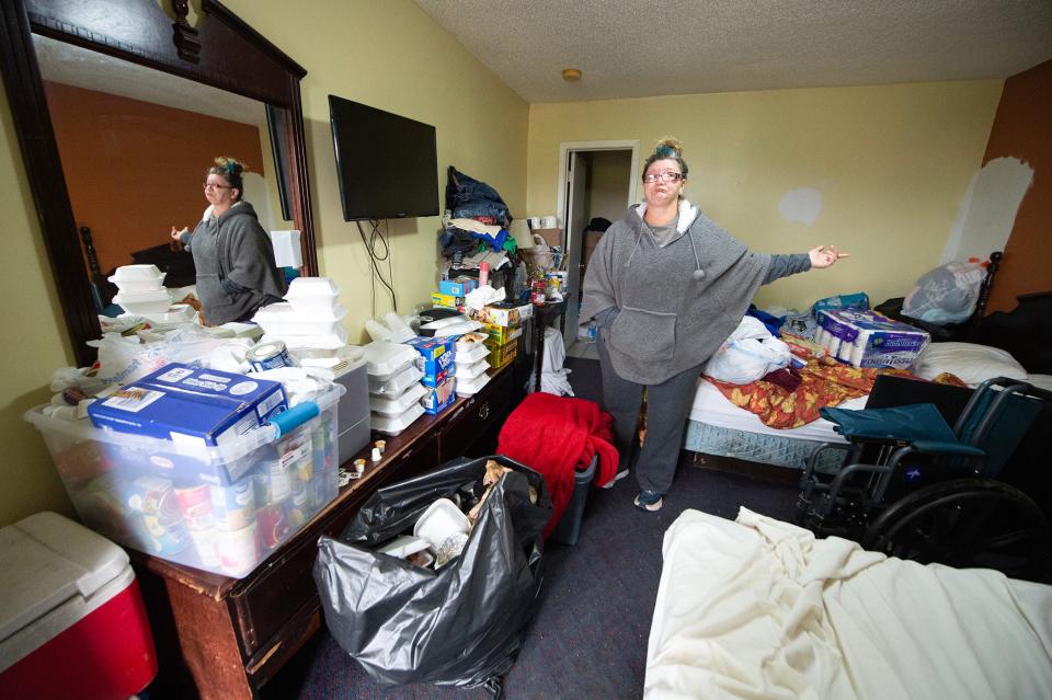 Lorlie Smith talks Wednesday about what she and her husband’s room at the Rolling Fork Motel is salvaged from their home, a stone’s throw from the motel, and what has been donated to them after an EF-4 tornado hit the small Delta town last Friday. All that was recovered from their home sits in a plastic bin, at her feet, covered by a red blanket.