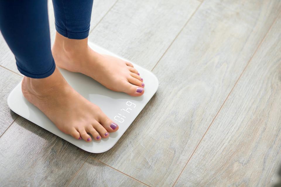 Our weight tends to increase as we age. <a href="https://www.shutterstock.com/image-photo/close-photo-woman-legs-stepping-on-1947168976" rel="nofollow noopener" target="_blank" data-ylk="slk:Shutterstock;elm:context_link;itc:0;sec:content-canvas" class="link ">Shutterstock</a>