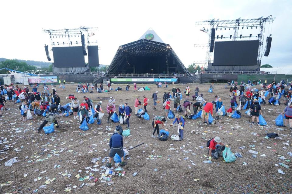 The clean up operation is taking place at the Glastonbury Festival (Yui Mok/PA) (PA Wire)