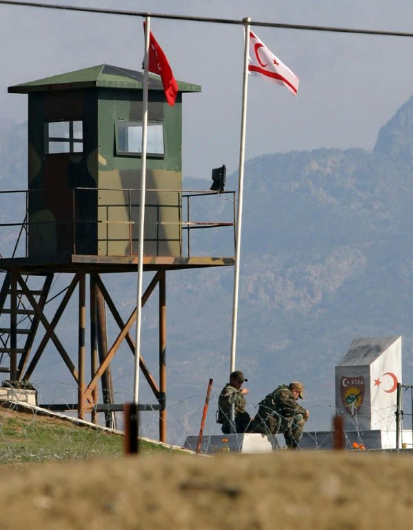 Turkish soldiers sun themselves while on duty at an observation post on the Green Line that divides Cyprus and its capital Nicosia