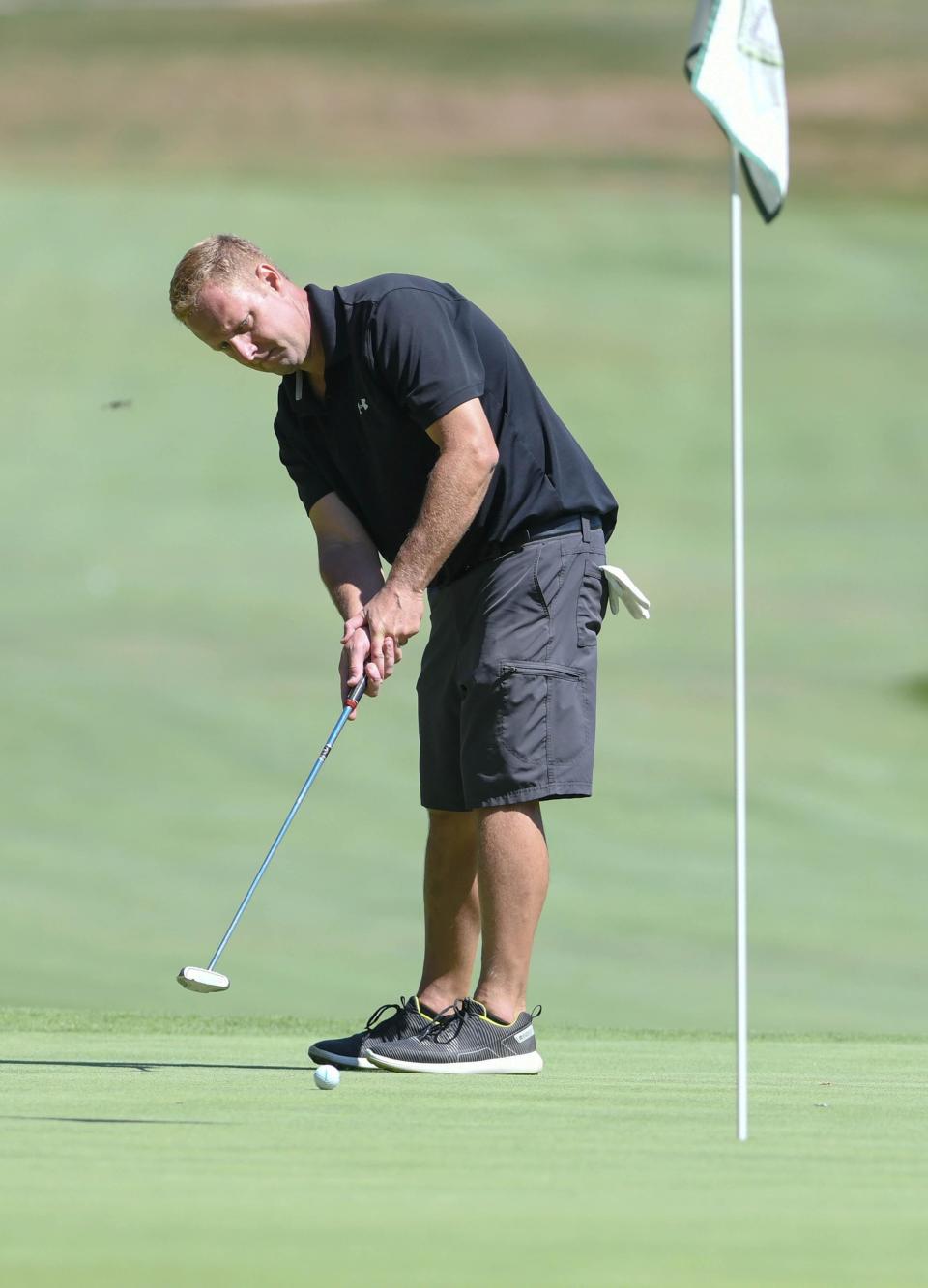Dave Oates putts during a recent Stark County Amateur Golf Tournament.