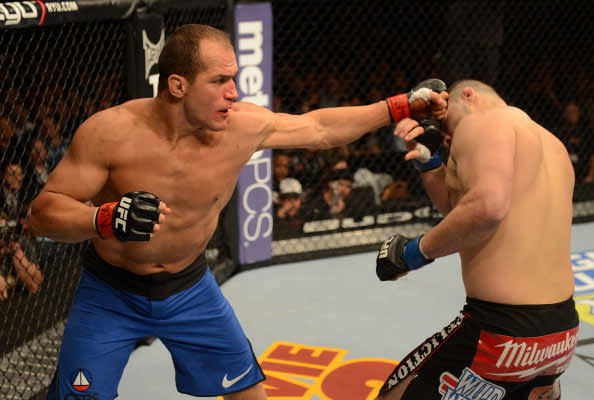 Junior dos Santos punches Cain Velasquez during their heavyweight title fight at UFC 155 on December 29, 2012. (Photo by Donald Miralle/Zuffa LLC/Zuffa LLC via Getty Images)