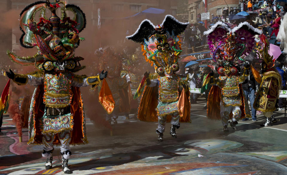Dancers perform the traditional "Diablada" or Dance of the Devils during the Carnival in Oruro, Bolivia, Saturday, March 2, 2019. The unique festival features spectacular folk dances, extravagant costumes, beautiful crafts, lively music, and up to 20 hours of continuous partying with lots of tourists, drawing crowds of up people annually. (AP Photo/Juan Karita)