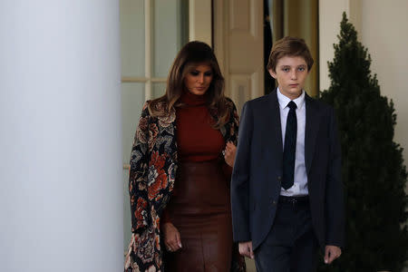 First Lady Melania Trump and her son Barron Trump participate in the 70th National Thanksgiving turkey pardoning ceremony in the Rose Garden of the White House in Washington, U.S., November 21, 2017. REUTERS/Carlos Barria