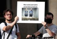 Members of the group "The Voices of Nuclear" demonstrate in reaction to the closure of the Fessenheim nuclear power plant in front of Greenpeace headquarters in Paris