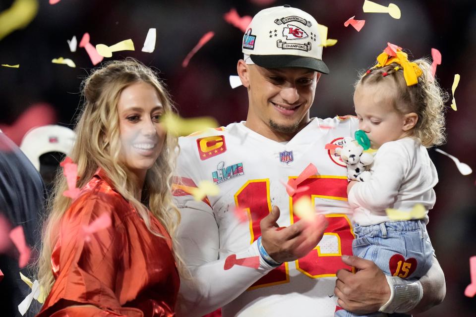 Kansas City Chiefs quarterback Patrick Mahomes (15) and his wife Brittany, left, celebrate with their daughter, Sterling Skye Mahomes, after the NFL Super Bowl 57 football game, Sunday, Feb. 12, 2023, in Glendale, Ariz. The Kansas City Chiefs defeated the Philadelphia Eagles 38-35. (AP Photo/Seth Wenig)