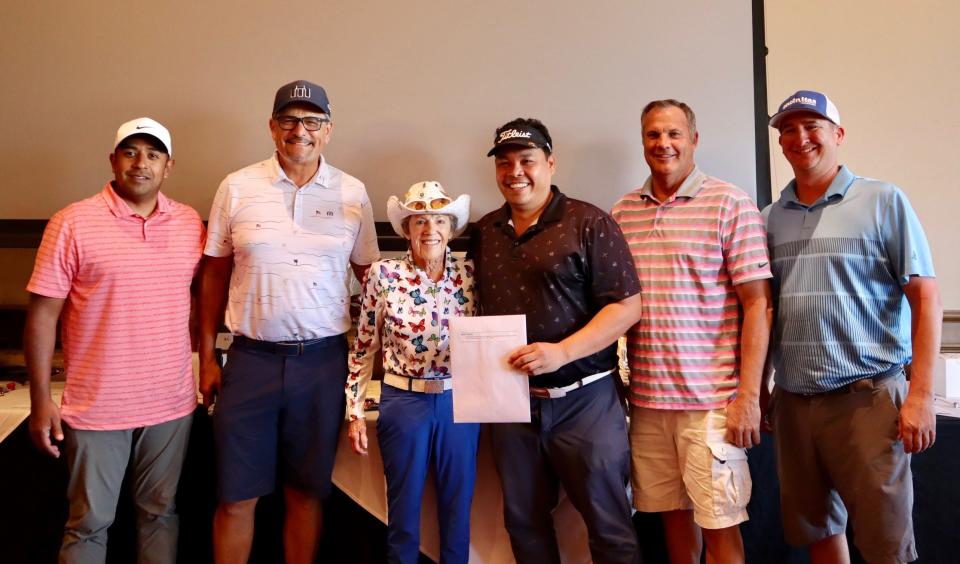 Dan Martinez (second from left) and Susie Maxwell Berning (center) pose with first place winners Arcenio Ramirez, Wendell Bugatai, Bryant Hill and Matt Schenk
at the Riverside County Foundation on Aging’s 10th annual Charity Golf Tournament on Oct. 1, 2022.