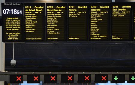 The notice board at London Bridge Station shows all trains cancelled during rush hour in London October 28, 2013. REUTERS/Dylan Martinez