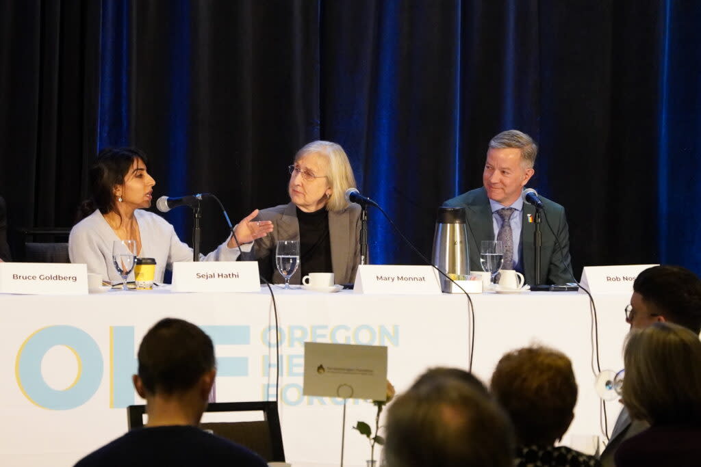 Oregon Health Authority Director Dr. Sejal Hathi speaks at a forum in Portland on Wednesday, April 24, 2024, with Mary Monnat, president and CEO of Lifeworks NW, and Rep. Rob Nosse, D-Portland. (Ben Botkin/Oregon Capital Chronicle)