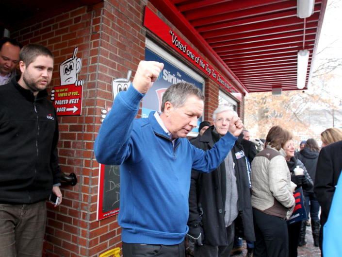 <p>Republican presidential candidate Ohio Gov. John Kasich pumps his fists as he leaves the Red Arrow Diner during a campaign stop in Manchester, N.H., on Feb. 9, 2016. <i>(Photo: Mary Schwalm/Reuters)</i></p>