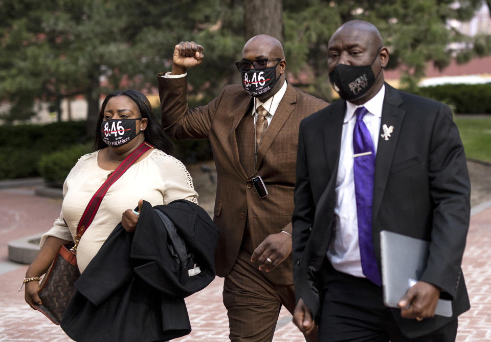 Philonise Floyd raises his fist as he leaves the Hennepin County Government Center with Keeta Floyd and Attorney Ben Crump on April 5, 2021 in Minneapolis. (Stephen Maturen / Getty Images file)