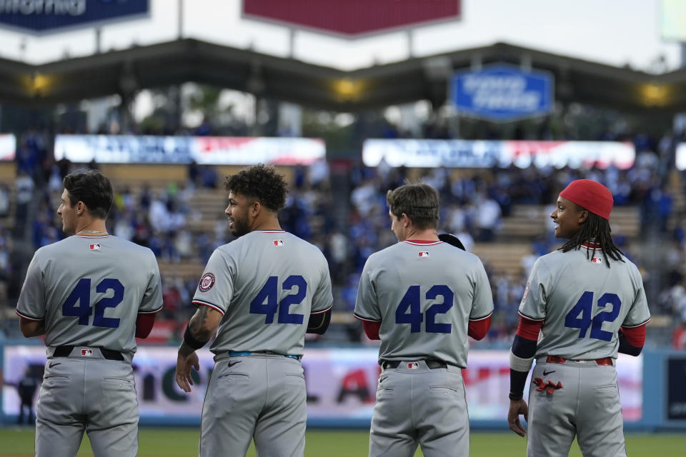 Members of the Washington Nationals wear No. 42 in honor of Jackie Robinson at a baseball game against the Los Angeles Dodgers, Monday, April 15, 2024, in Los Angeles. (AP Photo/Marcio Jose Sanchez)