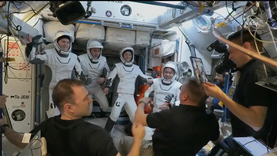 The Crew-5 astronauts, wearing their SpaceX pressure suits, bid their space station crewmates farewell before boarding a Crew Dragon spacecraft for return to Earth Saturday night. Left to right: cosmonaut Anna Kikina, pilot Josh Cassada, commander Nicole Mann and Japanese astronaut Koichi Wakata. / Credit: NASA