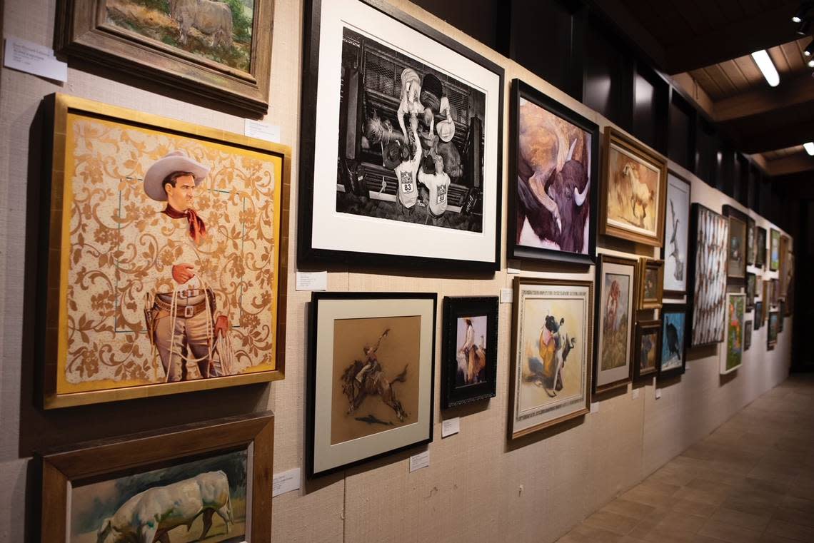 Paintings hang in the Keeneland Sales Pavilion in advance of the tenth annual sporting art auction.