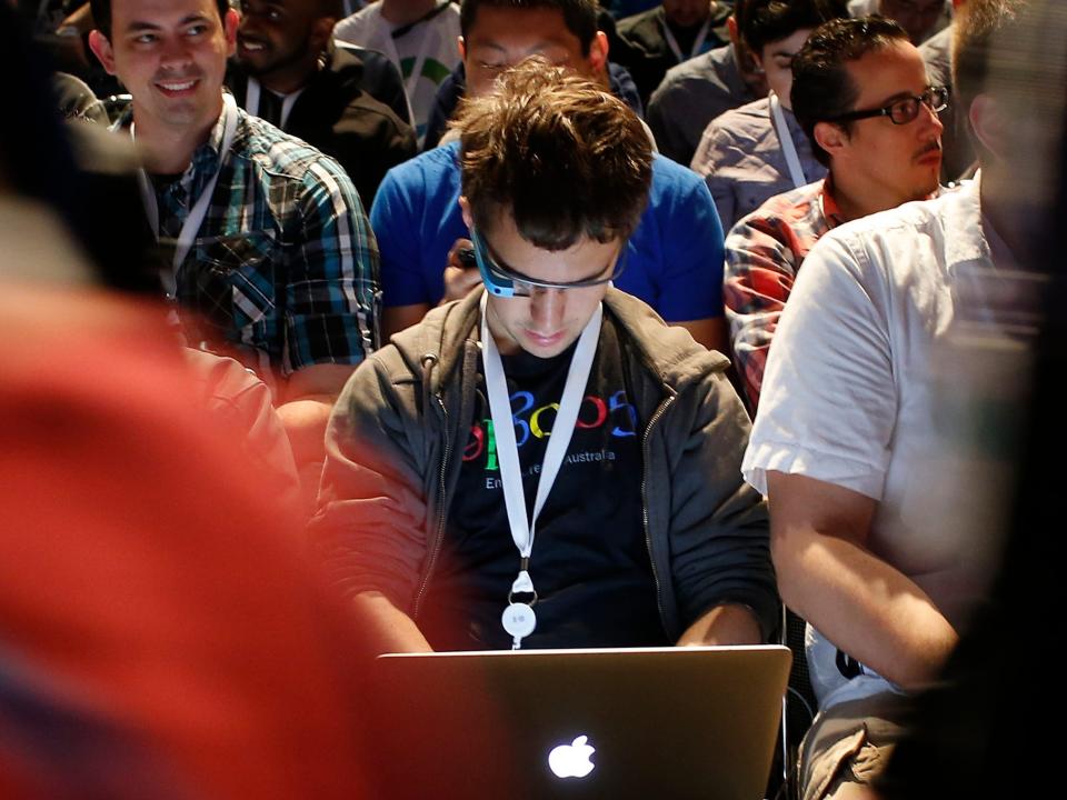 SAN FRANCISCO, CA - JUNE 25: An attendee works on a computer during Google I/O Developers Conference at Moscone Center West on June 25, 2014 in San Francisco, California. The seventh annual Google I/O Developers conference is expected to draw thousands through June 26. (Photo by Stephen Lam/Getty Images)