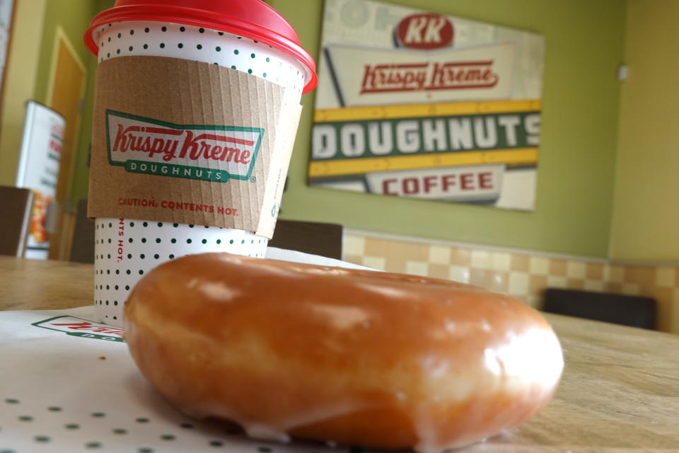 DALY CITY, CALIFORNIA - MAY 12: In this photo illustration, a Krispy Kreme glazed doughnut is shown on May 12, 2022 in Daly City, California. Krispy Kreme reported strong first quarter earnings with net income of $4 million compared with a loss of $3.06 million one year ago. (Photo Illustration by Justin Sullivan/Getty Images)