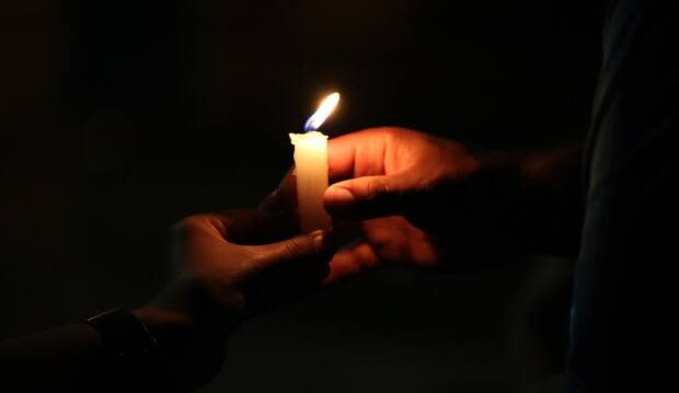 People will be asked to light a candle. Organizer Blake Sittler said, 'People know what it means to light a candle in the window ... for the weary traveler to just find their way through the darkness.' (Derek Spalding/CBC - image credit)