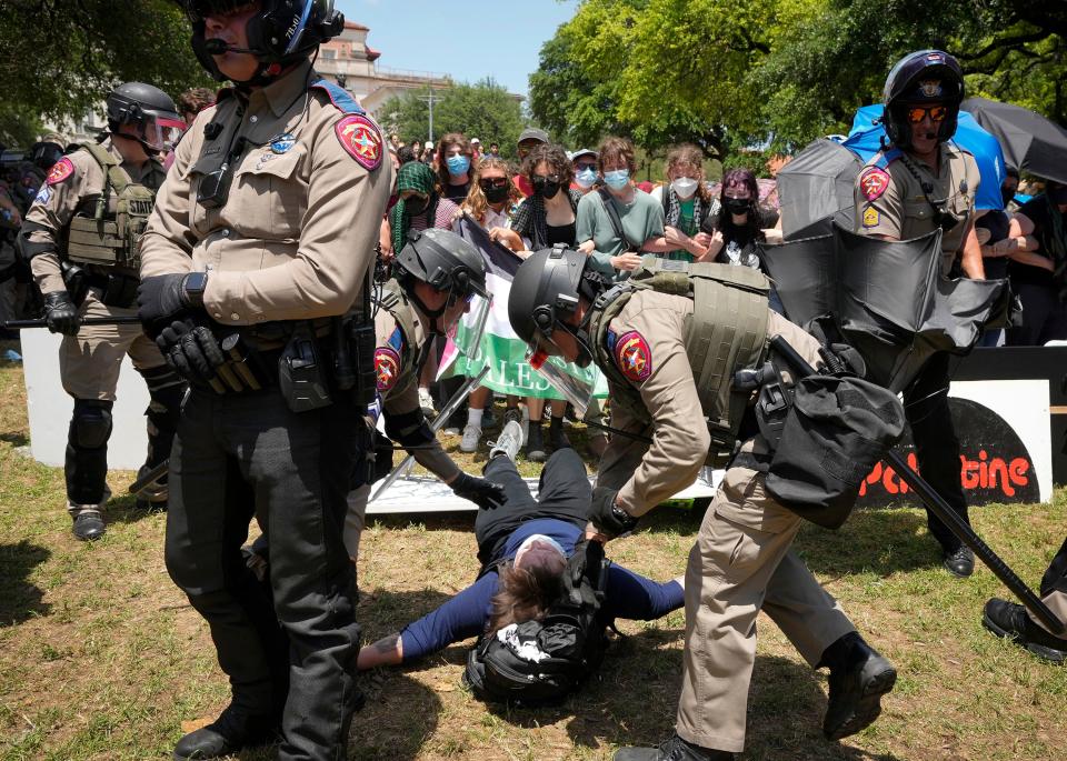 State troopers arrest a man at the pro-Palestinian protest Monday at UT.