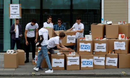 FILE PHOTO: Protesters demonstrate against the possible stockpiling of medecines and food in the event of a no-deal Brexit in London, Britain. Aug 22, 2018. REUTERS/Peter Nicholls/File Photo