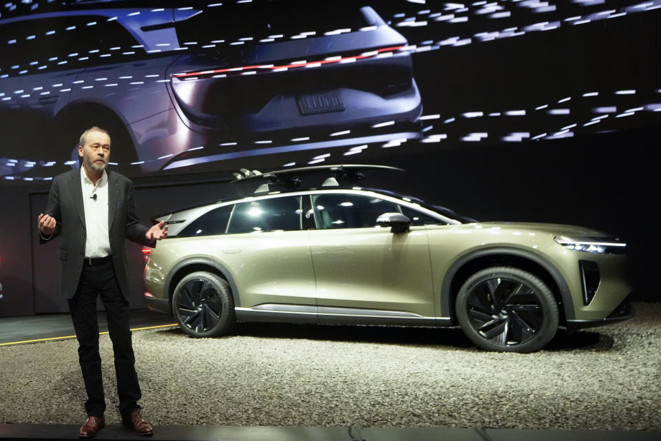 Lucid Motors CEO Peter Rawlinson introduces the all-electric SUV 2025 Lucid Gravity at the AutoMobility LA Auto Show, Thursday, Nov. 16, 2023, in Los Angeles. (AP Photo/Damian Dovarganes)