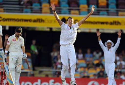 South African bowler Morne Morkel (C) appeals unsuccessfully for the wicket of Australian batsman Ed Cowan (L) on day three of the first cricket Test between South Africa and Australia at the Gabba ground in Brisbane. South Africa were on track to end Australia's unbeaten 24-year Test run at the Gabba after dominating the third day's play