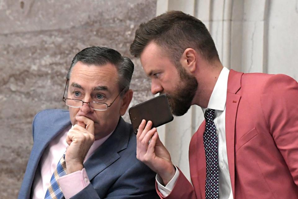 Then-Tennessee House Speaker Glen Casada, left, and his then-chief of staff, Cade Cothren, speak during session in Nashville on May 1, 2019.