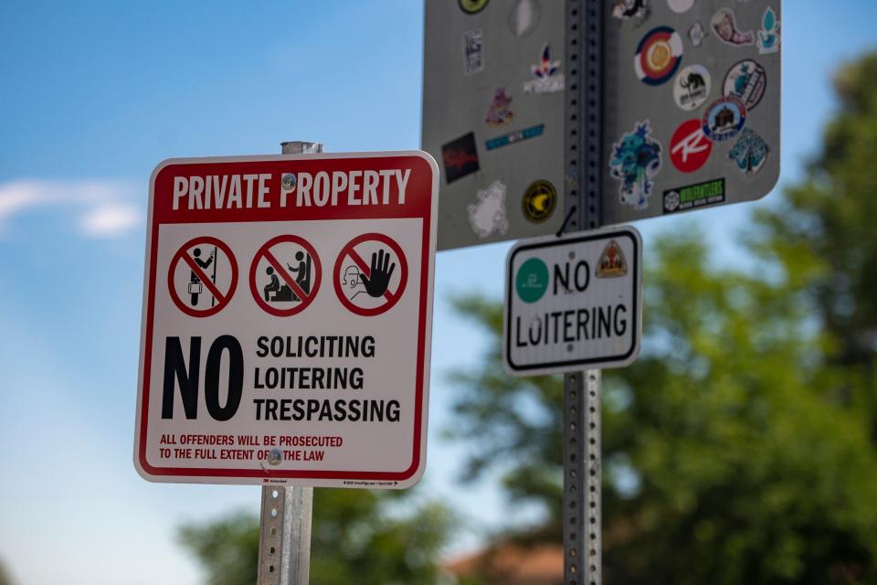 No loitering signs are posted near the entrance of the Whole Foods Market off South College Avenue in Fort Collins on Tuesday.