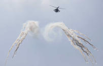 A South Korean AH-64E jet fires flares during the media day for the 74th anniversary of Armed Forces Day at the military base in Gyeryong-City, South Korea, Thursday, Sept. 29, 2022. Armed Forces Day is observed on Saturday, Oct. 1. (Jeon Heon-Kyun/Pool Photo via AP)