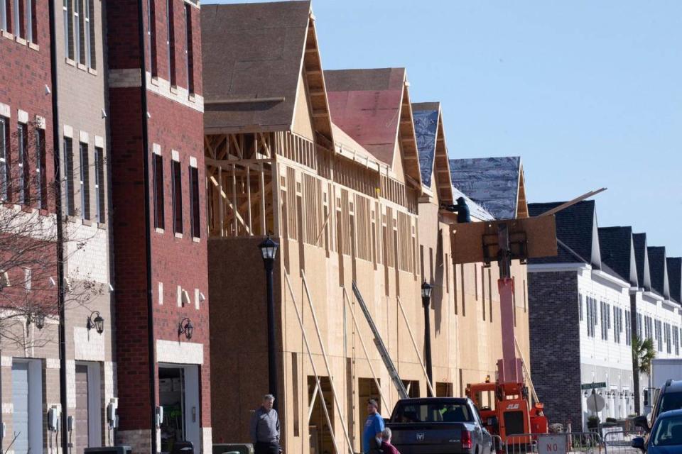 Construction continues with the final phase of townhomes being built at Market View at Market Common along Howard Street in Myrtle Beach, S.C. Feb. 15, 2024.