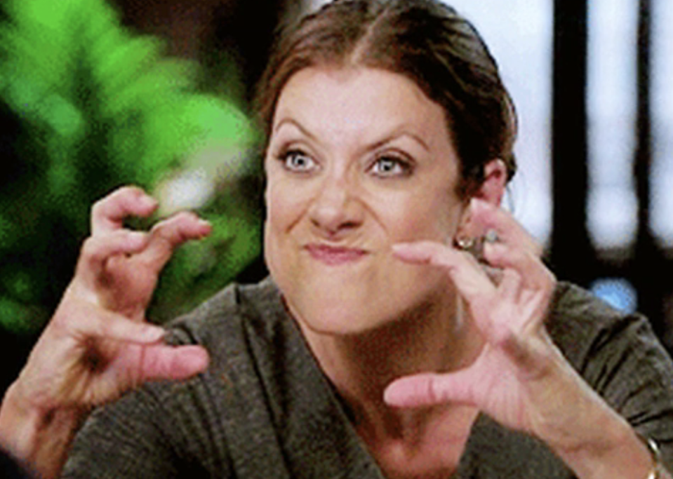 Kate Walsh making a fierce facial expression with claw-like hand gestures