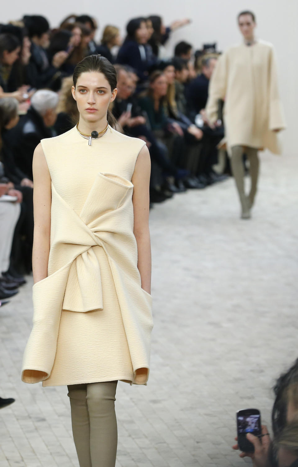 A model presents a creation for Celine's Ready to Wear Fall-Winter 2013-2014 fashion collection, presented Sunday, March 3, 2013 in Paris. (AP Photo/Jacques Brinon)