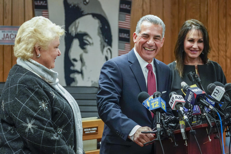 Republican gubernatorial candidate Jack Ciattarelli, center, is joined by his wife Melinda, lright, and candidate for Lt. Gov. Diane Allen as he speaks during a news conference, Friday, Nov. 12, 2021, in Raritan, N.J. Ciattarelli conceded the race to Democratic Gov. Phil Murphy. (AP Photo/Mary Altaffer)