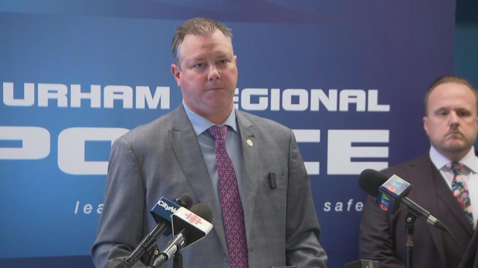 Det. Sgt. Brad Corner of Durham Regional Police is shown at a news conference on Friday, March 8. Police say they are continuing to investigate other people after arresting three men in connection with a double killing of a man and a pregnant woman in Bowmanville in February 2023.