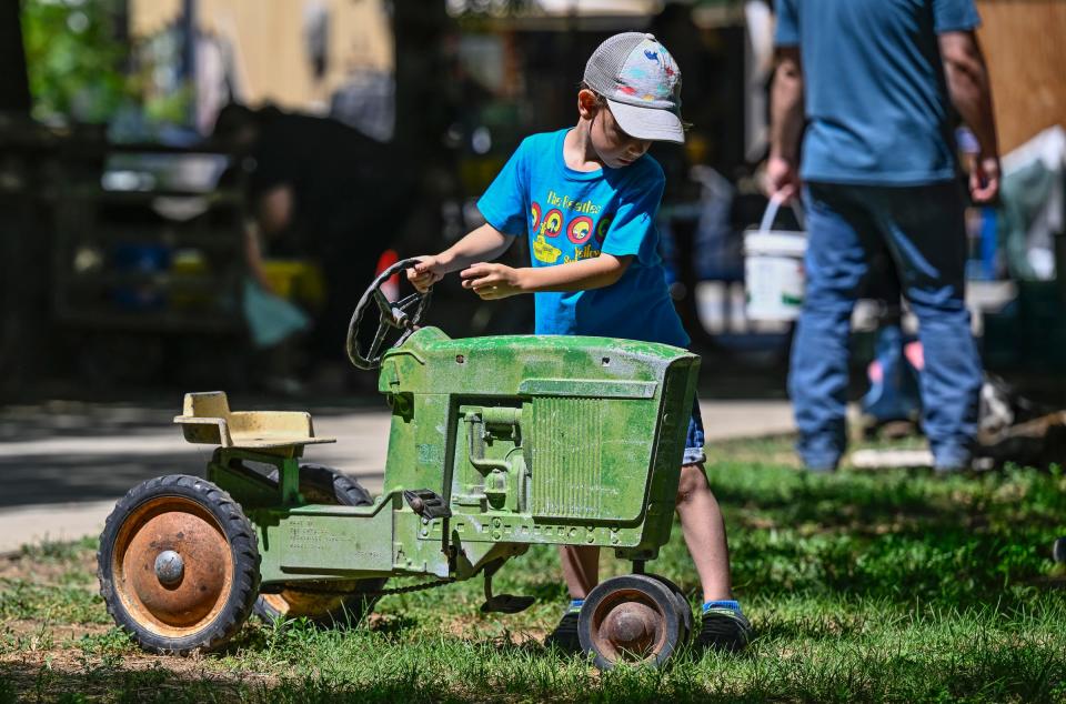 Lukas Walker, 5, of Bakersfield plays after picking blueberries at Heavenly Wheels Blueberry Farm on Tuesday, May 21, 2024