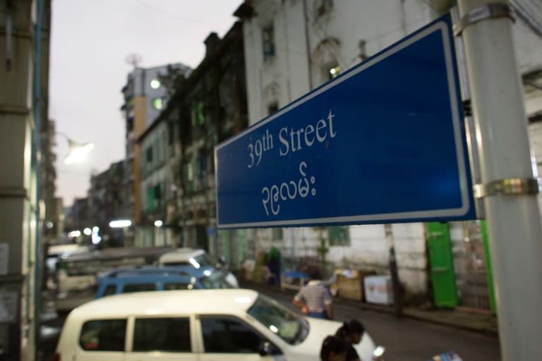 A sign on 39th Street in Yangon where a British man was found dead inside his co-worker's apartment with wounds on his head and chest on November 6, 2016