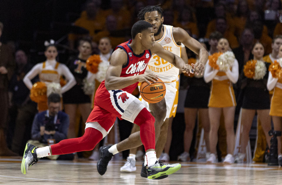 Mississippi guard Matthew Murrell (11) drives against Tennessee guard Josiah-Jordan James (30) during the first half of an NCAA college basketball game Saturday, Jan. 6, 2024, in Knoxville, Tenn. (AP Photo/Wade Payne)