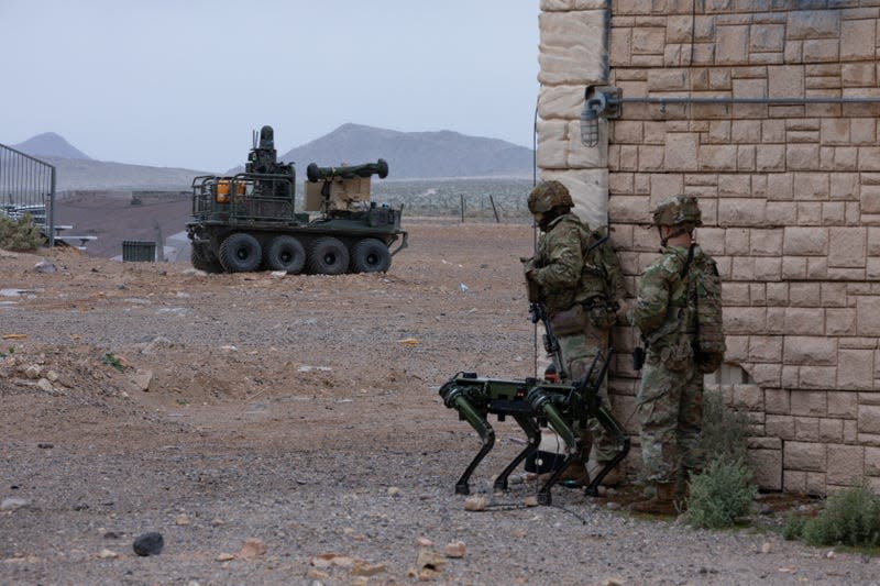 U.S. Soldiers assigned to the 1st Battalion, 29th Infantry Regiment, based out of Fort Moore, Ga., take part in a human machine integration demonstration using the Ghost Robotic Dog, and the U.S. Army Small Multipurpose Equipment Transport (SMET) of new U.S. Army capabilities at Project Convergence - Capstone 4 in Fort Irwin, Calif., March 15, 2024. - Photo: U.S. Army photo by Spc. Samarion Hicks