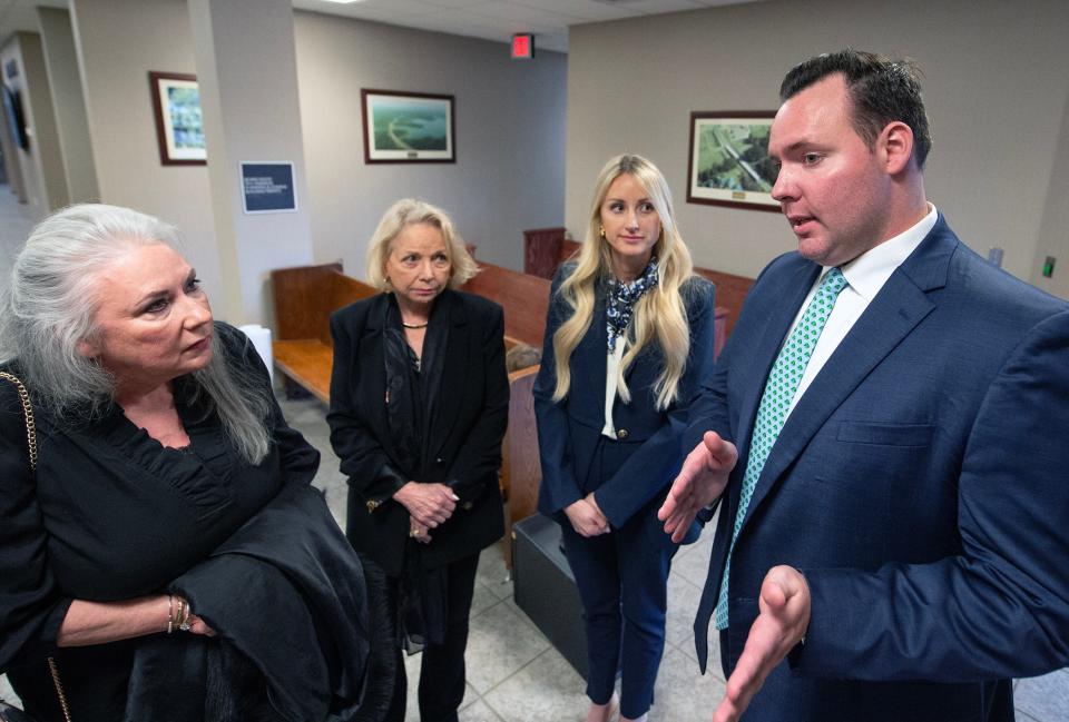 Chad Phillips, from right, and his wife Crystal Phillips, owner/operators of the proposed assisted living facility in Livingston in Madison County, with her mother Sharon Gardner and his mother Linda Phillips, discuss why they want to move ahead with the project after attending a board of supervisors meeting in Canton on Thursday.