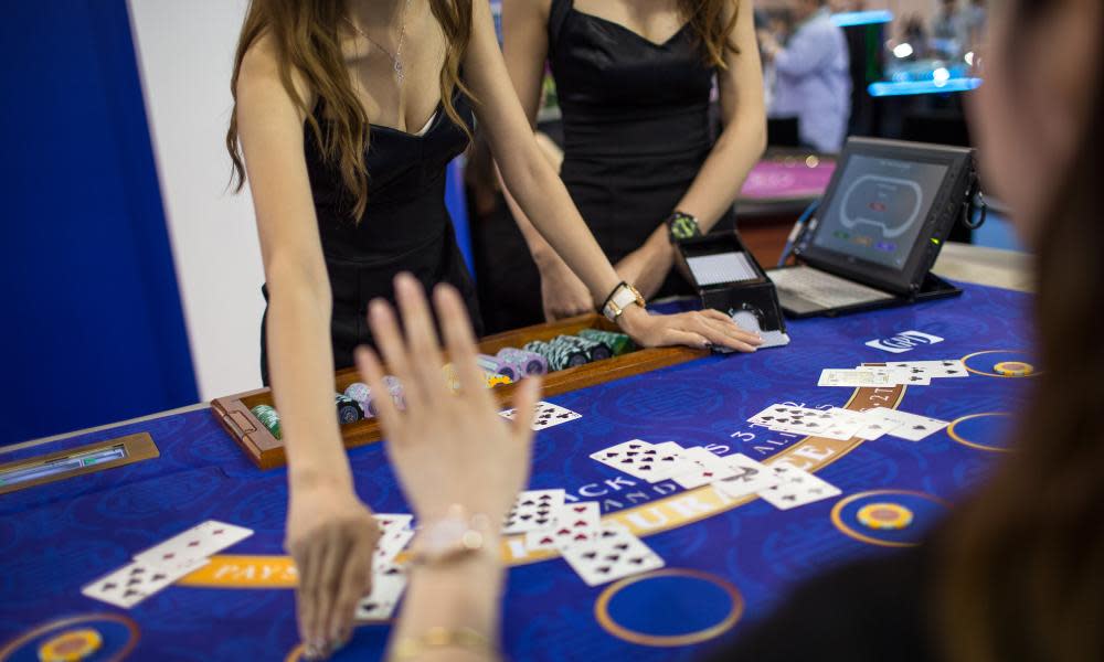 Two female croupiers at a blackjack table