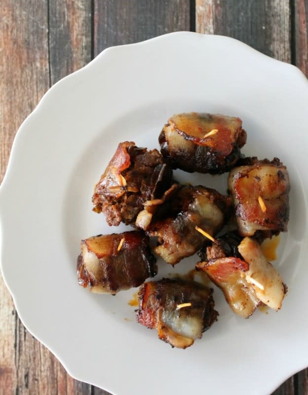 <p>Bread Booze Bacon</p><p>These are everything right about party food! One bite and you’re in sweet and spicy, bacon-y heaven! </p><p><strong>Get the recipe: <a href="https://breadboozebacon.com/bacon-wrapped-chorizo-stuffed-dates/" rel="nofollow noopener" target="_blank" data-ylk="slk:Bacon-Wrapped Chorizo Stuffed Dates;elm:context_link;itc:0;sec:content-canvas" class="link rapid-noclick-resp">Bacon-Wrapped Chorizo Stuffed Dates</a></strong></p>