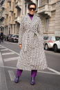 The social media star pulled off a patterned coat with purple pants at the Max Mara show on February 23