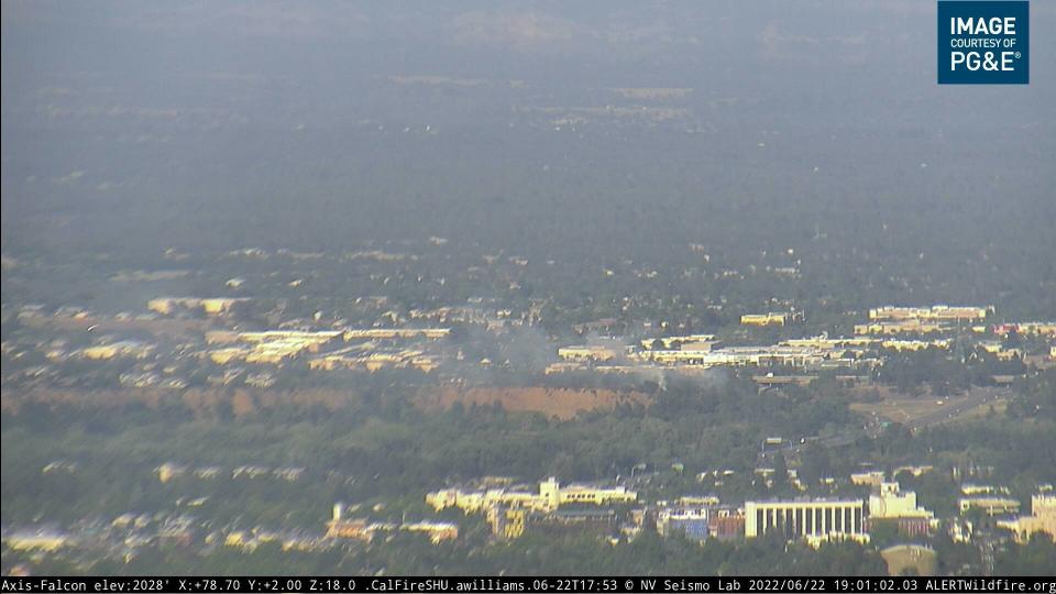 Smoke rises from a fire on the Sacramento River Trail, as seen from an outdoor camera provided by Pacific Gas & Electric Co. on Wednesday, June 22, 2022.