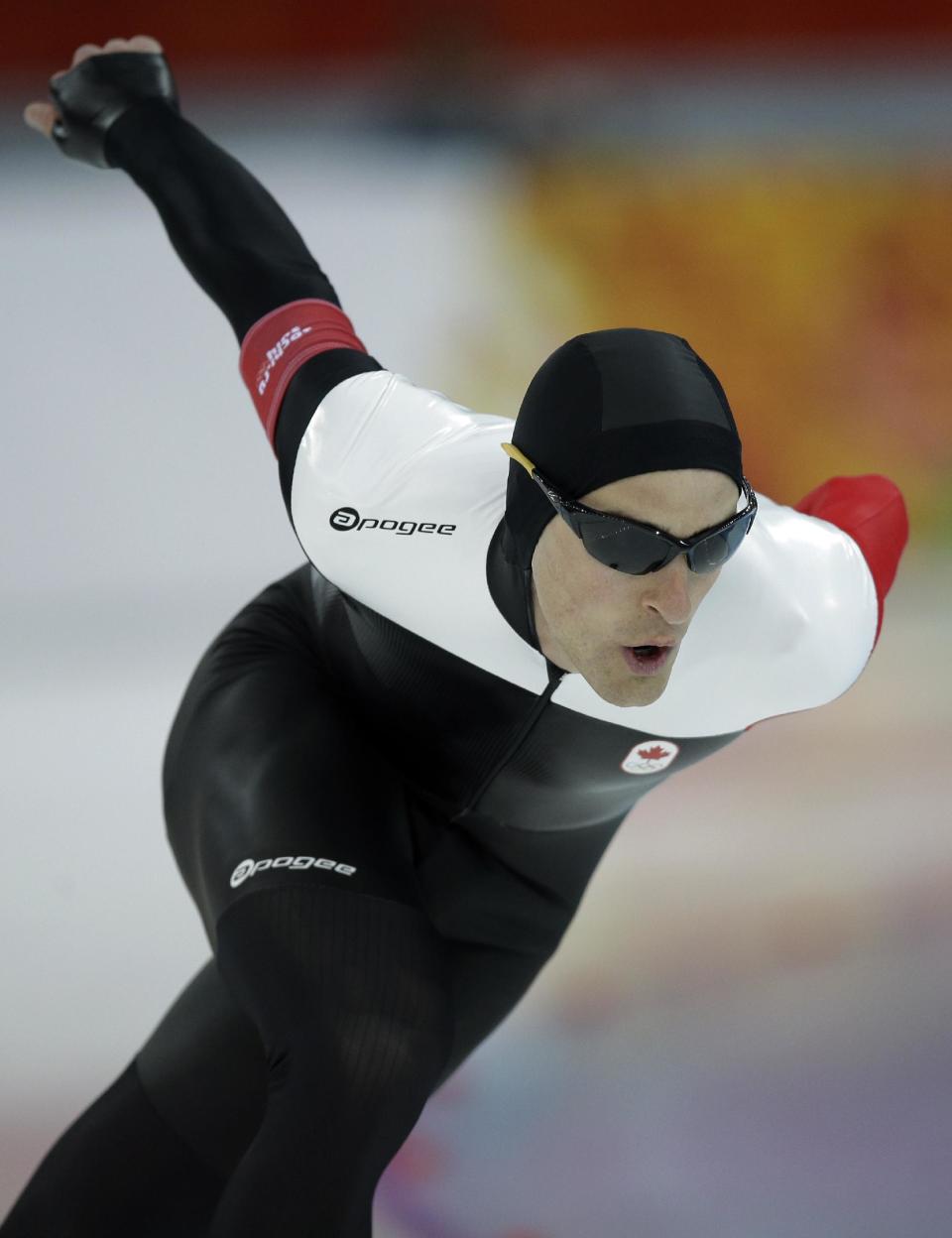 Silver medallist Canada's Denny Morrison competes in the men's 1,000-meter speedskating race at the Adler Arena Skating Center during the 2014 Winter Olympics in Sochi, Russia, Wednesday, Feb. 12, 2014. (AP Photo/Pavel Golovkin)