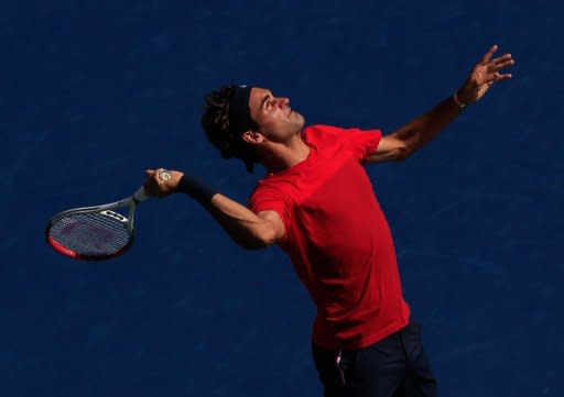 Roger Federer of Switzerland serves while practicing prior to the start of the 2012 US Open at the USTA Billie Jean King National Tennis Center on August 26, 2012 in the Flushing neighborhood, of the Queens borough of New York City